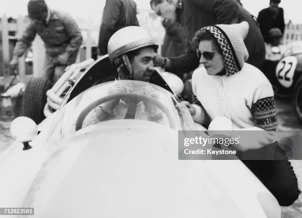 Stuart Lewis-Evans of Great Britain sits aboard the Bernie Ecclestone entered Cooper T45 Climax Straight-4 before the start of the VI Glover Trophy...