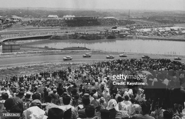 Spectators line the circuit to watch the race during the first Japanese Grand Prix for sports cars which was won by Peter Warr on 3 May 1963 at the...
