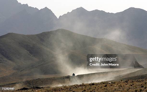 American forces pass through the vast arid landscape June 23, 2006 near Deh Afghan in the Zabul province of Afghanistan. Troops from the 2nd...