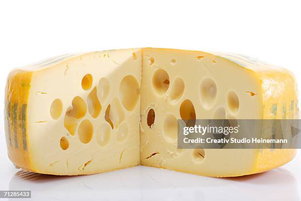 block of swiss cheese, close-up - swiss cheese stock pictures, royalty-free photos & images