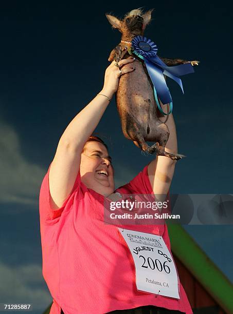 Heather Peoples of Phoenix, Arizona holds her Chinese Crested dog Archie after he was crowned the World's Ugliest Dog at the 18th annual World's...