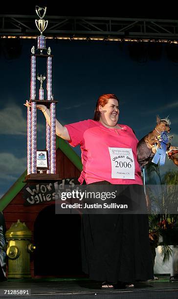 Heather Peoples of Phoenix, Arizona holds her Chinese Crested dog Archie after he was crowned the World's Ugliest Dog at the 18th annual World's...