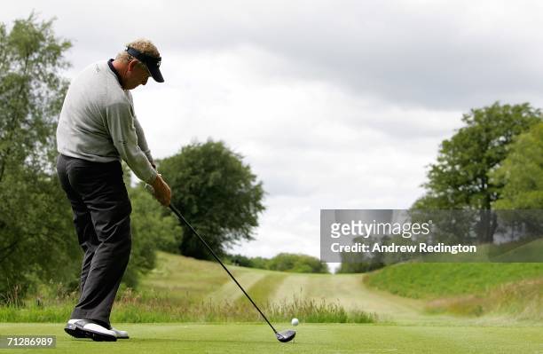 Colin Montgomerie of Scotland tees off on the fifth hole during the third round of The Johnnie Walker Championship on The PGA Centenary Course at...
