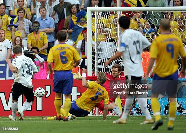 Lucas Podolski of Germany, scores his team's second goal during the FIFA World Cup Germany 2006 Round of 16 match between Germany and Sweden at the...