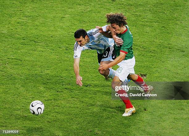 Lionel Scaloni of Argentina tussles for posession with Andres Guardado of Mexico during the FIFA World Cup Germany 2006 Round of 16 match between...