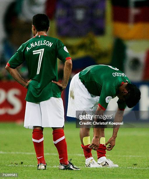 Carlos Salcido and Zinha of Mexico show their dejection at the end of the FIFA World Cup Germany 2006 Round of 16 match between Argentina and Mexico...