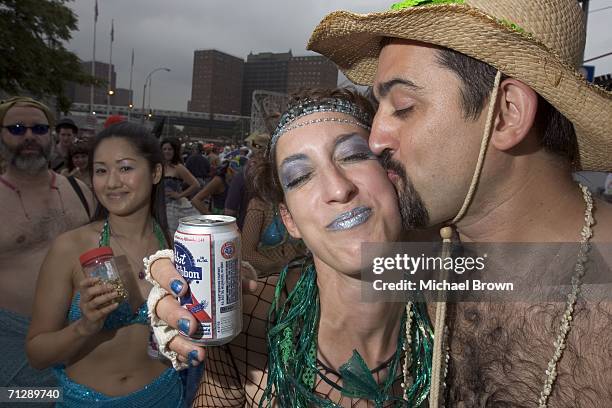 Participants attend the 2006 Mermaid Parade, the nation's largest art parade, June 24, 2006 on Coney Island in the Brooklyn borough of New York City....