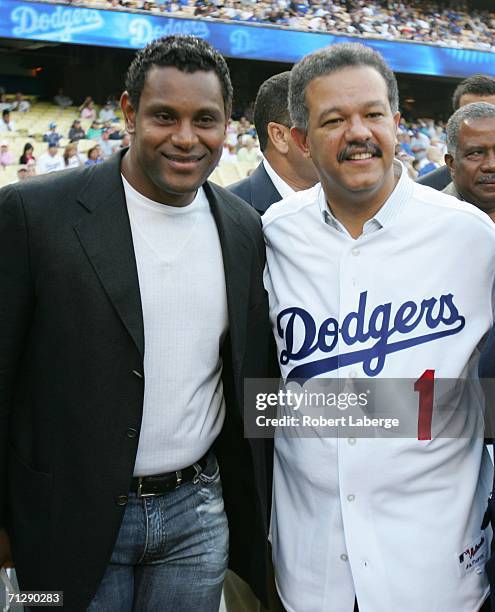 Sammy Sosa appears with Dominican President Leonel Fernandez before Fernandez threw the first pitch before the game between the Los Angeles Dodgers...