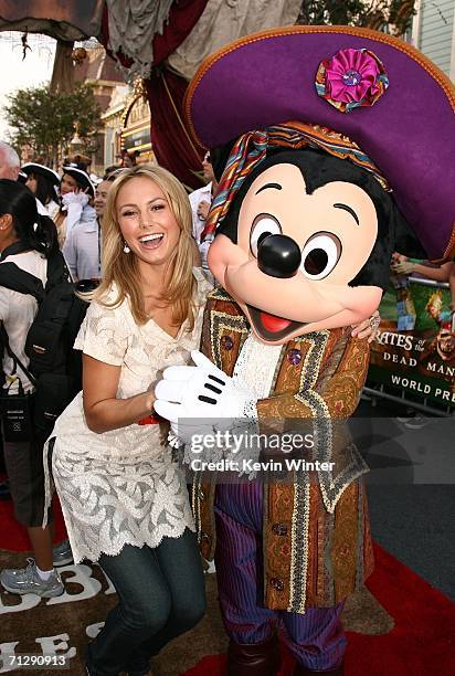 Wrestler Stacy Keibler and Mickey Mouse arrive at the world premiere of "Pirates of the Caribbean 2: Dead Man's Chest" held at Disneyland on June 24,...