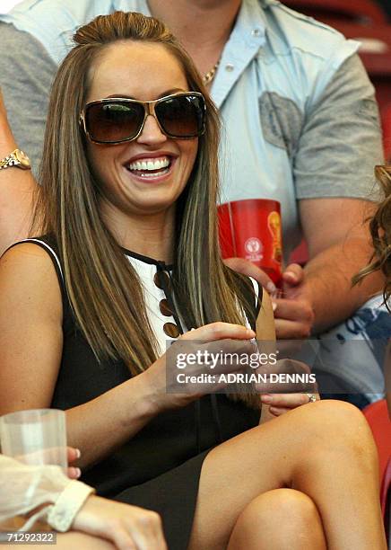 Elen Rives, the girlfriend of English midfielder Frank Lampard, sits with other friends and family members of the English team ahead of the round of...