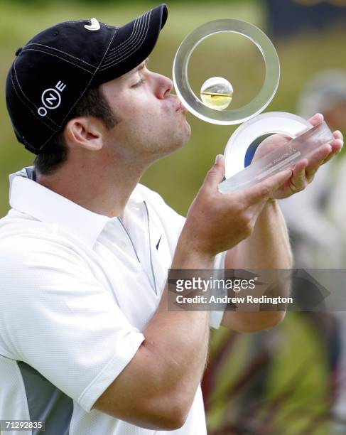Paul Casey of England kisses the trophy after winning The Johnnie Walker Championship on The PGA Centenary Course at Gleneagles on June 25, 2006 in...