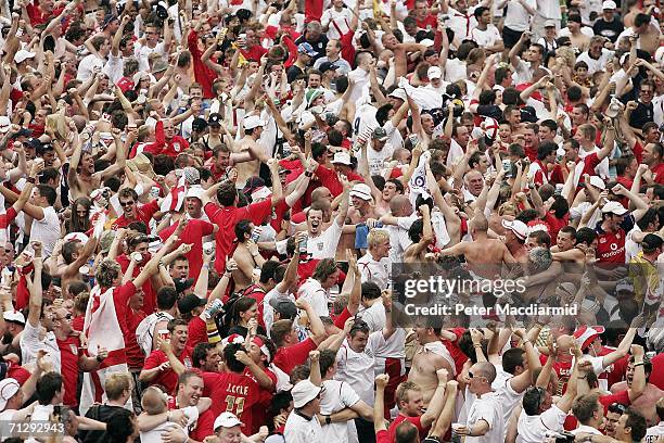 England football fans celebrate their team's goal against Ecuador on June 25, 2006 in central Stuttgart, Germany.