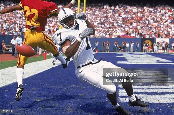 Bryant Johnson of the Penn State Nittany Lions misses the ball for a touchdown as Darrell Rideaux of the USC Trojans tries to block him during the...