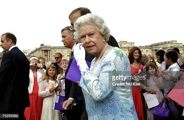 Queen Elizabeth II attends the Children's Garden Party as part of the Queen?s 80th Birthday celebrations at the Buckingham Palace on June 25, 2006 in...