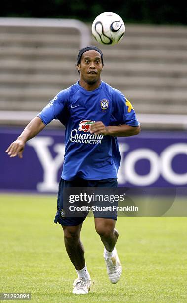 Ronaldinho of Brazil keeps an eye on the ball during the Brazil National Football Team training session for the FIFA World Cup Germany 2006 at the...