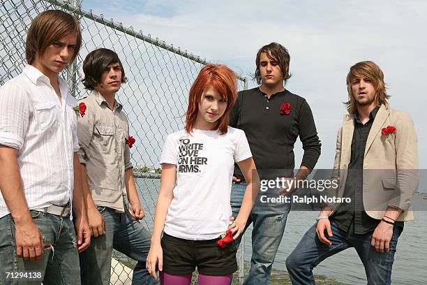 Hunter Lamb, Josh Farro, Haley Williams, Jeremy Davis, and Zac Farrro of Paramore pose for photos during the Vans Warped Tour at Bicentennial Park on...