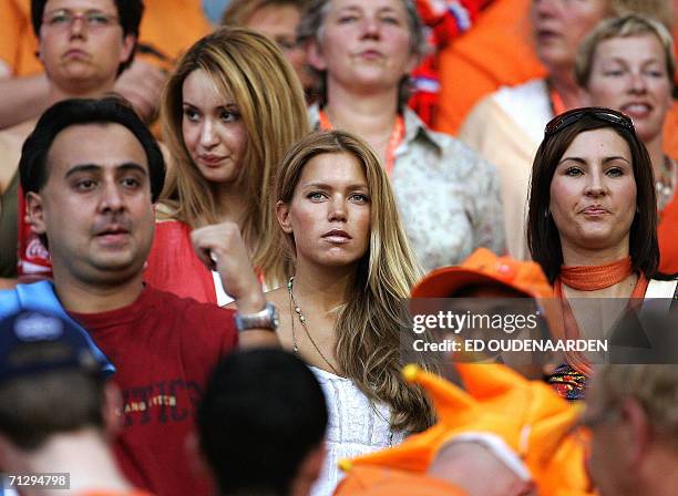 Dutch team soccer wives Sylvie van der Vaart and the the wife of Robin van Persie watch the World Cup 2006 match against Portugal 25 June 2006 in the...