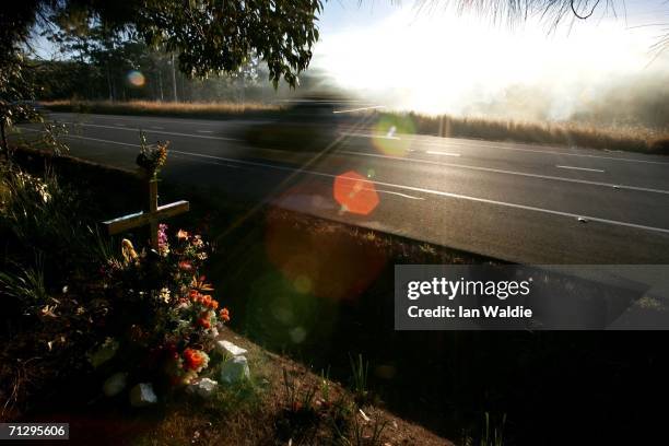 Memorial cross marks the spot on the road where a person died in an unadated car accident on the Pacific Highway June 25, 2006 near Kempsey,...