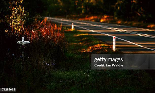 Memorial cross marks the spot on the road where a person died in an unadated car accident on the Pacific Highway June 25, 2006 near Kempsey,...