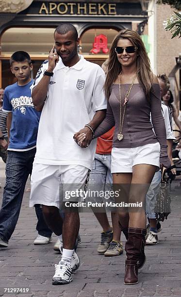 England footballer Ashley Cole and his partner Cheryl Tweedy walk to the shops on June 26, 2006 in Baden-Baden, Germany. England will face Portugal...