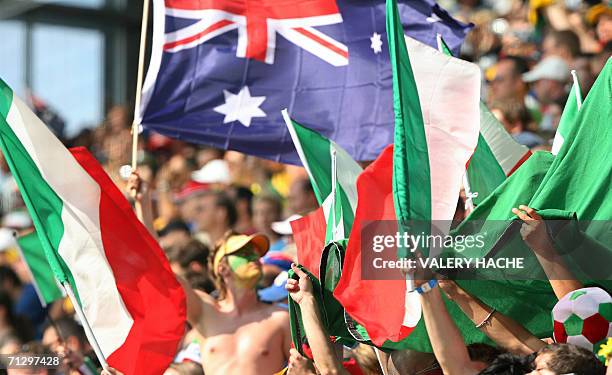 Kaiserslautern, GERMANY: An Australia supporter waves the country's flag around Italy supporters waving theirs at the start of the round of 16 World...