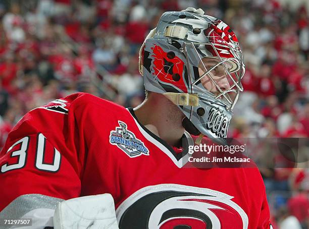 Cam Ward of the Carolina Hurricanes looks on against the Edmonton Oilers during game seven of the 2006 NHL Stanley Cup Finals on June 19, 2006 at the...