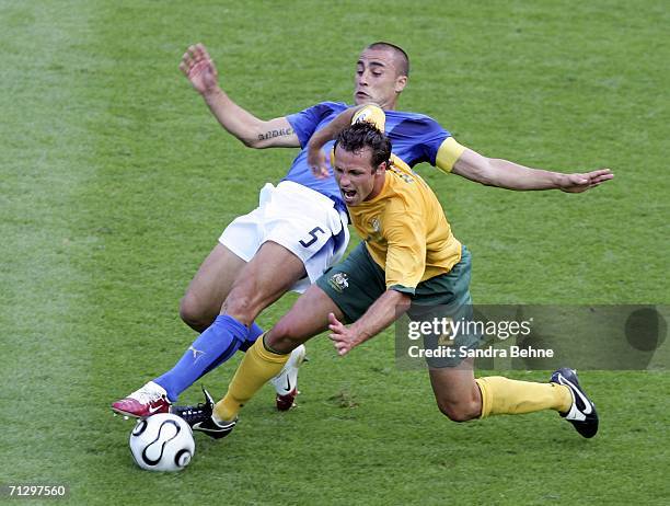 Lucas Neill of Australia is tackled by Fabio Cannavaro of Italy during the FIFA World Cup Germany 2006 Round of 16 match between Italy and Australia...