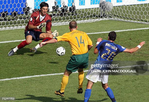 Kaiserslautern, GERMANY: Italian goalkeeper Gianluigi Buffon makes a save as Australian defender Scott Chipperfield clashes with Italian midfielder...