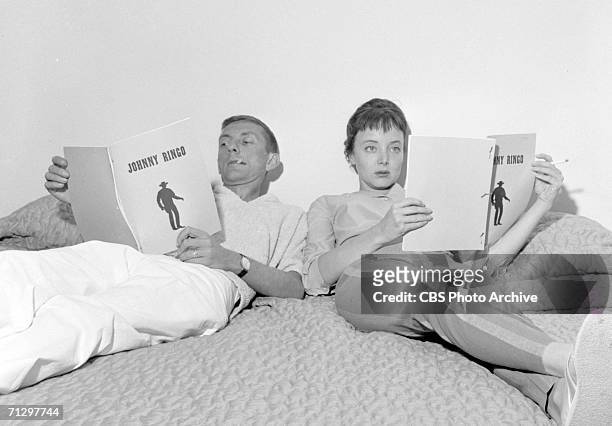 Aaron Spelling working in his new home, with his actress-wife Carolyn Jones. Reviewing script of the television series: Johnny Ringo, of which...