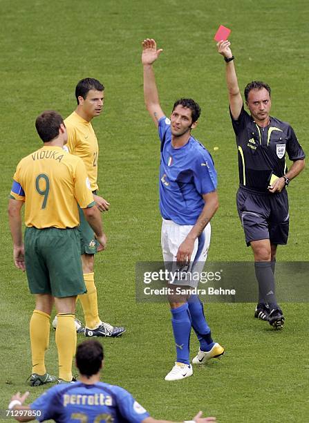 Marco Materazzi of Italy reacts, after receiving the red card from Referee Luis Medina Cantalejo of Spain, for his challenge on Marco Bresciano of...