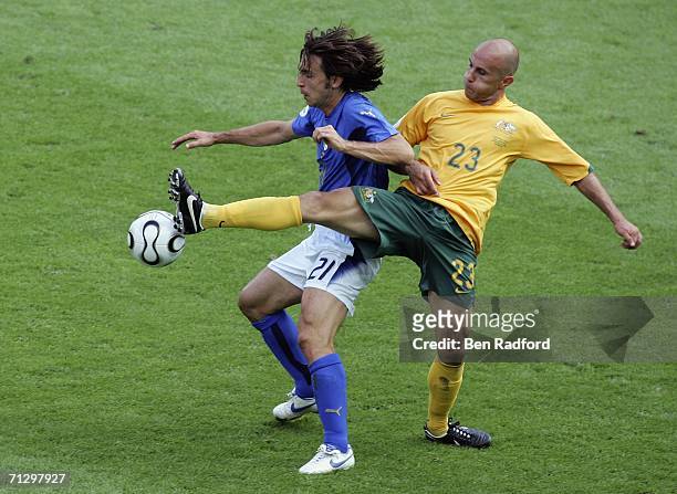 Andrea Pirlo of Italy is tackled by Marco Bresciano of Australia during the FIFA World Cup Germany 2006 Round of 16 match between Italy and Australia...