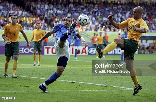 Gianluci Zambrotta of Italy and Marco Bresciano of Australia compete for the ball during the FIFA World Cup Germany 2006 Round of 16 match between...