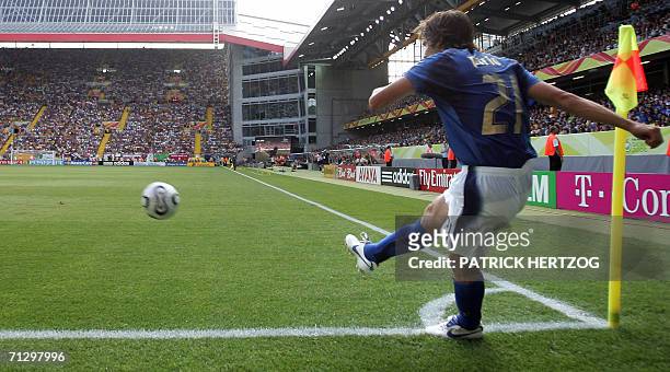 Kaiserslautern, GERMANY: Italian midfielder Andrea Pirlo takes a corner kick during the round of 16 World Cup football match between Italy and...