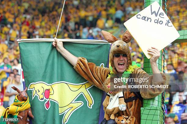 Kaiserslautern, GERMANY: An Australian fan dressed in a kangaroo costume cheers during the round of 16 World Cup football match between Italy and...