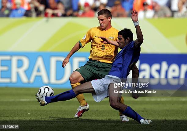 Simone Perrotta of Italy battles for the ball with Jason Culina of Australia during the FIFA World Cup Germany 2006 Round of 16 match between Italy...