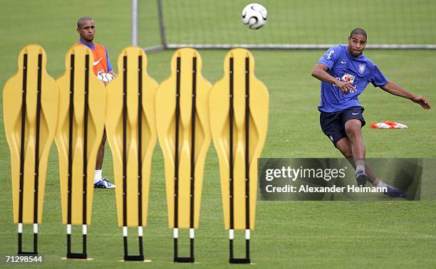 Roberto Carlos and Adriano defend free kicks during the training session of Brazilian National Team on June 26, 2006 in Bergisch Gladbach, Germany.