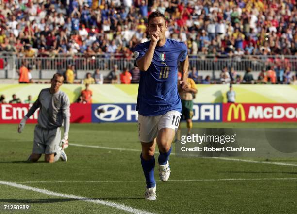 Francesco Totti of Italy celebrates, after scoring the match winning penalty during the FIFA World Cup Germany 2006 Round of 16 match between Italy...