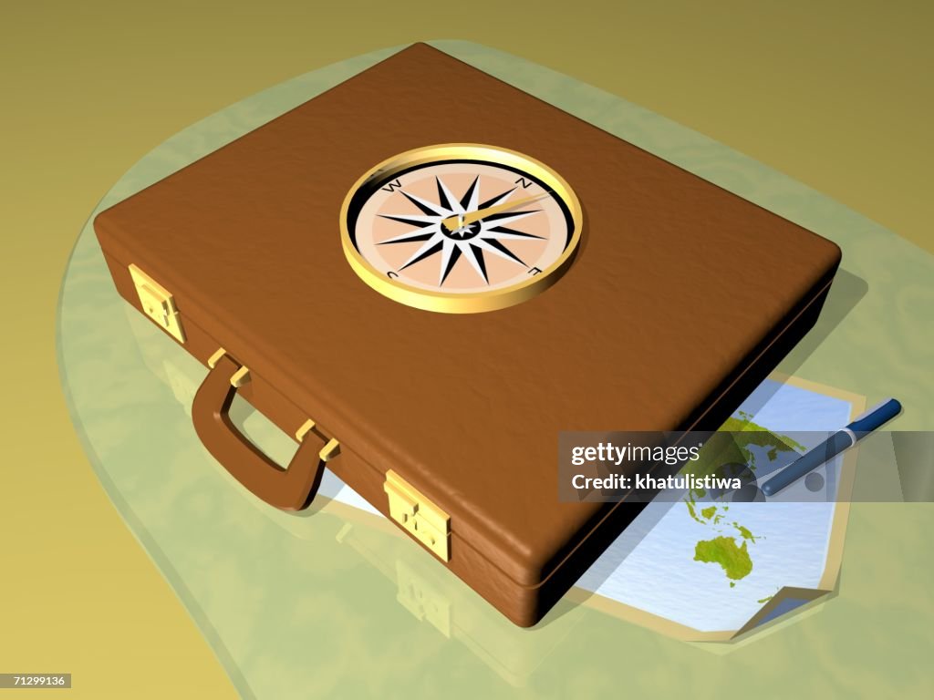 High angle view of a compass on a briefcase
