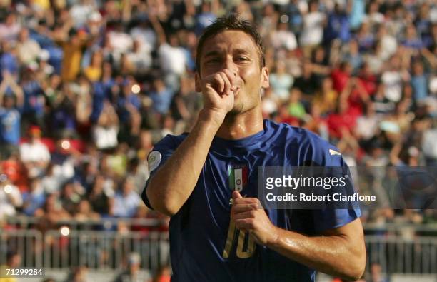 Francesco Totti of Italy celebrates, after scoring the match winning penalty during the FIFA World Cup Germany 2006 Round of 16 match between Italy...