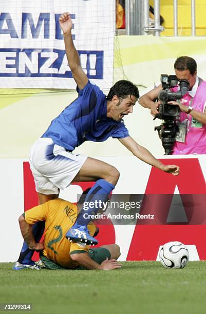 Fabio Grosso of Italy is brought down by Lucas Neill of Australia, to win his team the match winning penalty during the FIFA World Cup Germany 2006...