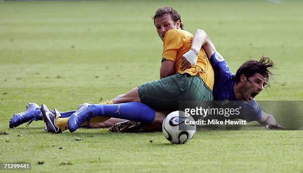 Lucas Neill of Australia tangles with Vincenzo Iaquinta of Italy during the FIFA World Cup Germany 2006 Round of 16 match between Italy and Australia...