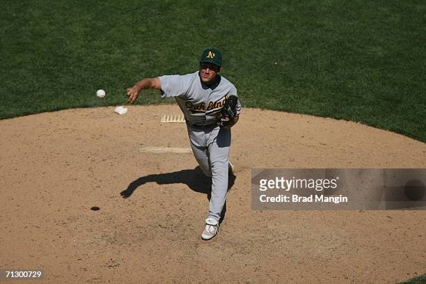 Huston Street of the Oakland Athletics pitches during the game against the San Francisco Giants at AT&T Park in San Francisco, California on June 24,...