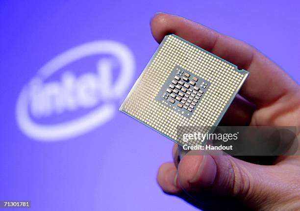 In this handout photo provided by Intel, Tom Kilroy, vice president of Intel?s Digital Enterprise Group, displays Intel's new Dual-Core Xeon...