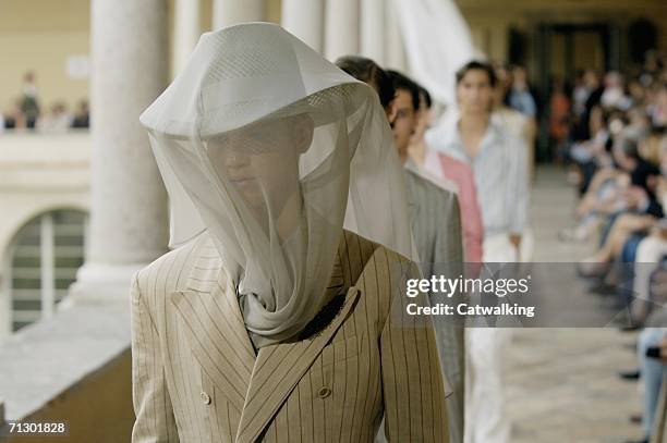 Models walk down the runway at the Alexander McQueen show as part of Milan Menswear Spring/Summer 2007 Collections on June 26, 2006 in Milan, Italy.