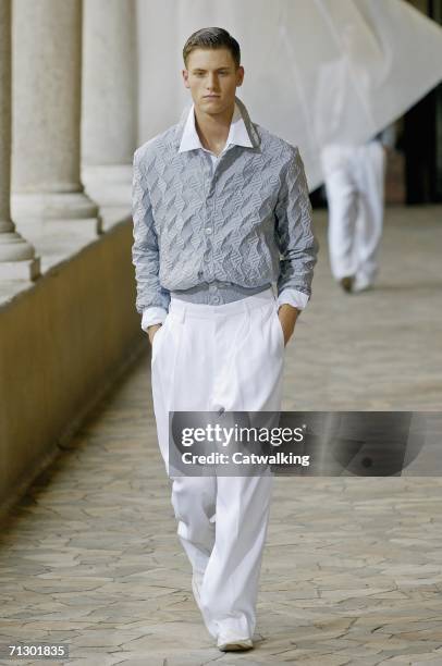 Model walks down the runway at the Alexander McQueen show as part of Milan Menswear Spring/Summer 2007 Collections on June 26, 2006 in Milan, Italy.