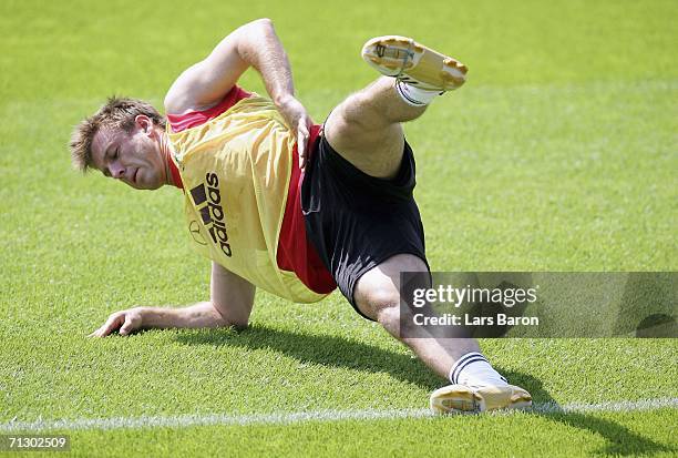 Bernd Schneider stretches during a German National Football Team training session on June 27, 2006 in Berlin, Germany.