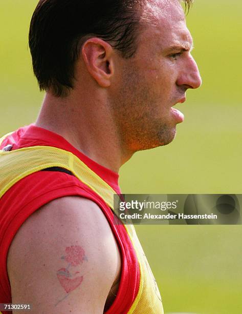 Tattoos are seen on the arm of Jens Nowotny of Germany during the German National Team training session on June 27, 2006 in Berlin, Germany.