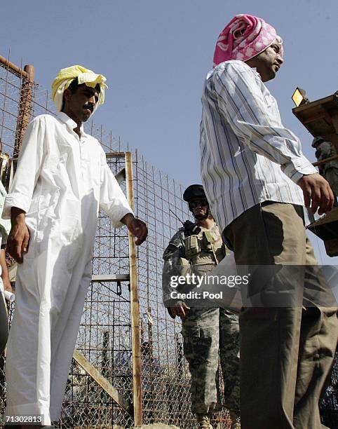 Detainees leave Abu Ghraib prison after waiting to be released on June 27, 2006 in Baghdad, Iraq. Another 500 detainees were released from Abu Ghraib...