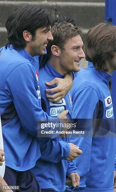 Goalkeeper Gianluigi Buffon and Francesco Totti smile during an Italy National Football Team training on June 27, 2006 in Duisburg, Germany.