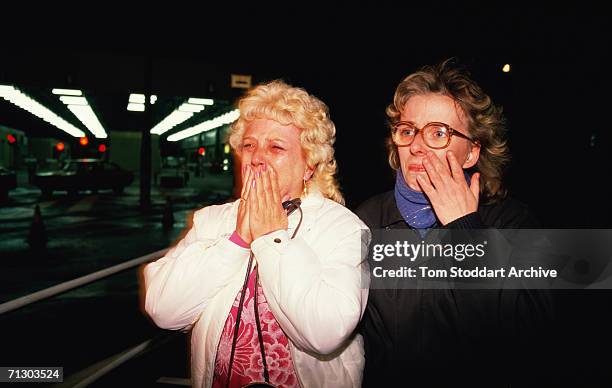 East German women cry with joy as they cross to freedom from East Berlin to the west through Checkpoint Charlie on the night of November 9th 1989...